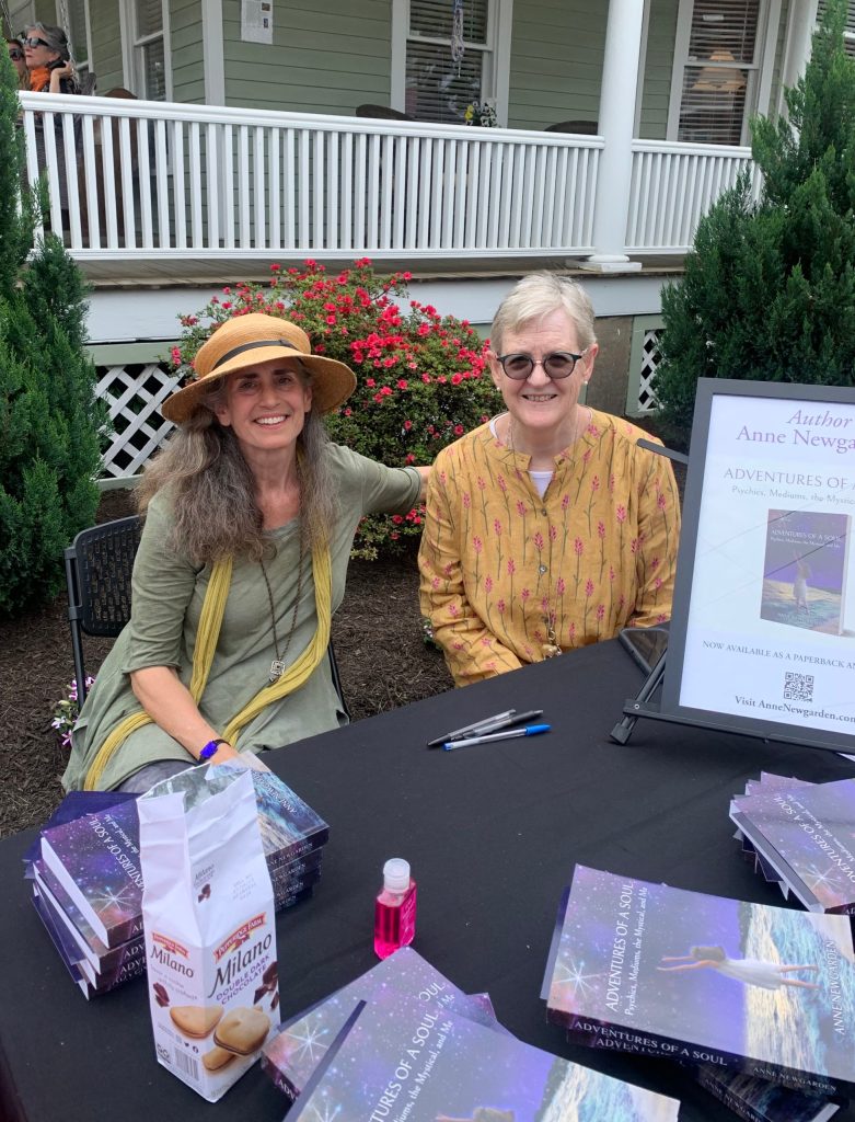 Anne Newgarden and another author seated behind a book-signing table at Commonplace Reader