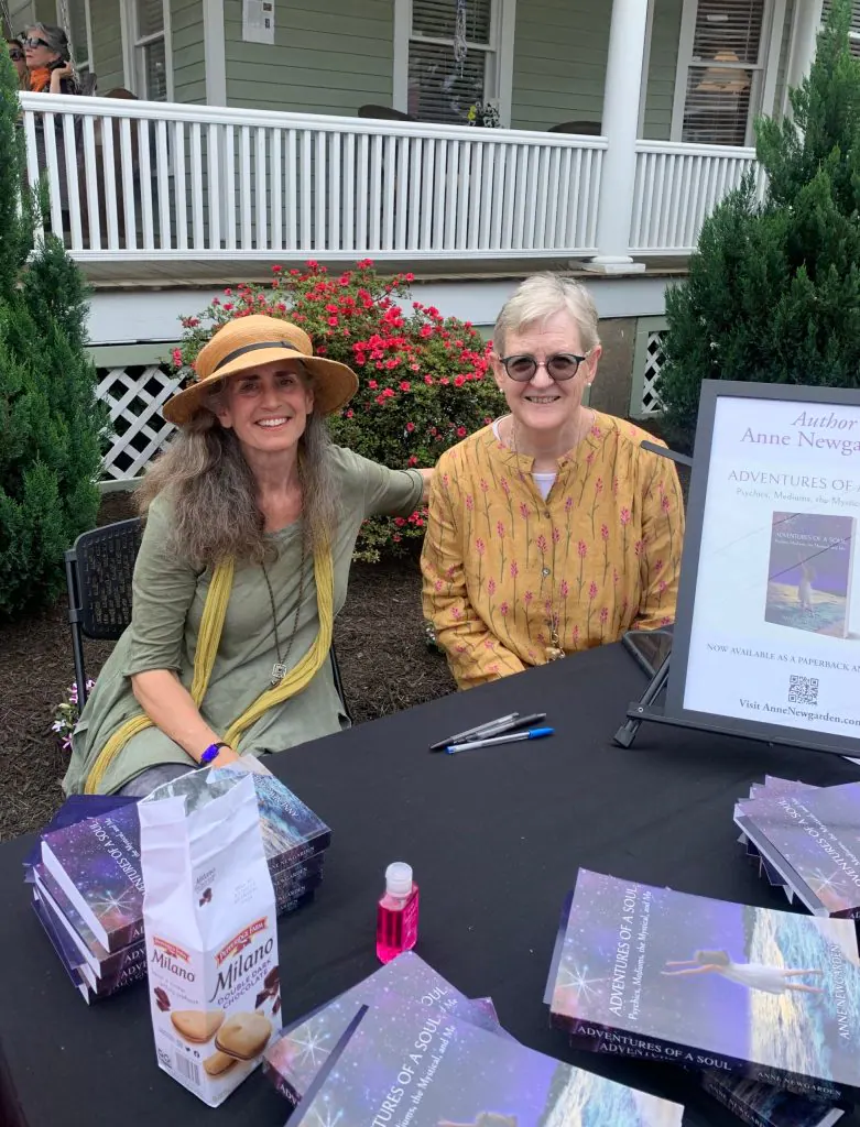 Anne Newgarden and another author seated behind a book-signing table at Commonplace Reader