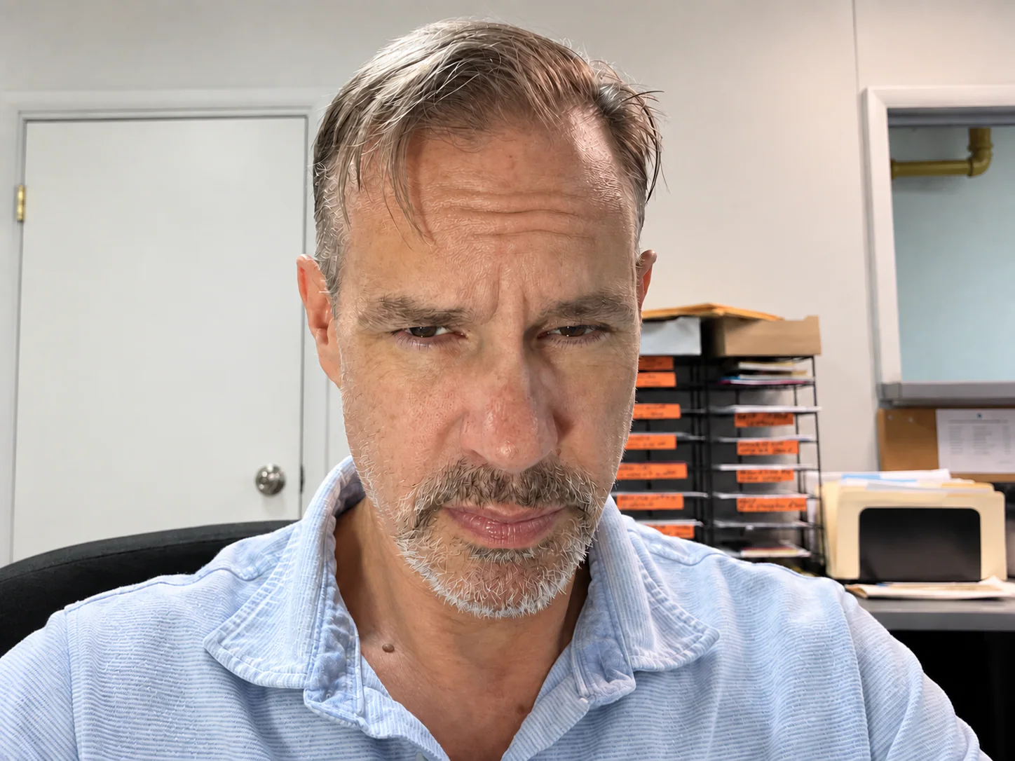 Soul Salon member with a gray goatee wearing a pale blue collared shirt