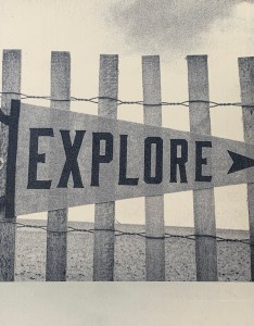 A sign displaying the word “EXPLORE”