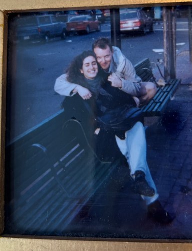 Anne Newgarden embracing a longtime friend on a city bench