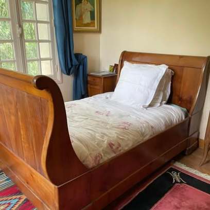 An antique wooden bed in the family home